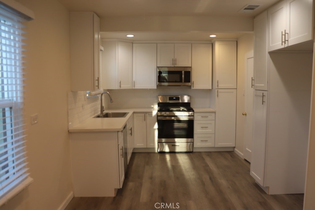 6865 Morro Road, Unit A Atascadero, CA 93422 - Photo 23 of 41 a kitchen with stainless steel appliances a refrigerator and a stove top oven