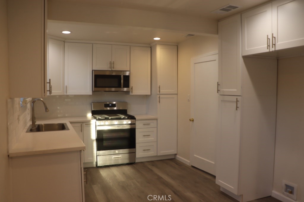 6865 Morro Road, Unit A Atascadero, CA 93422 - Photo 24 of 41 a kitchen with a stove and a refrigerator