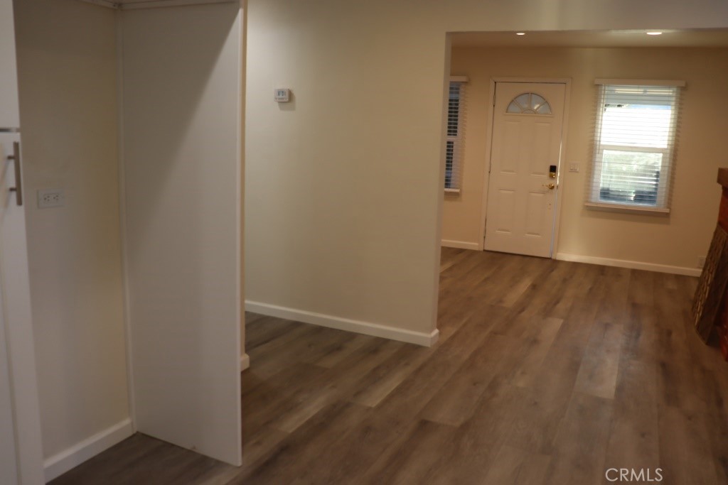 6865 Morro Road, Unit A Atascadero, CA 93422 - Photo 32 of 41 an empty room with wooden floor and windows