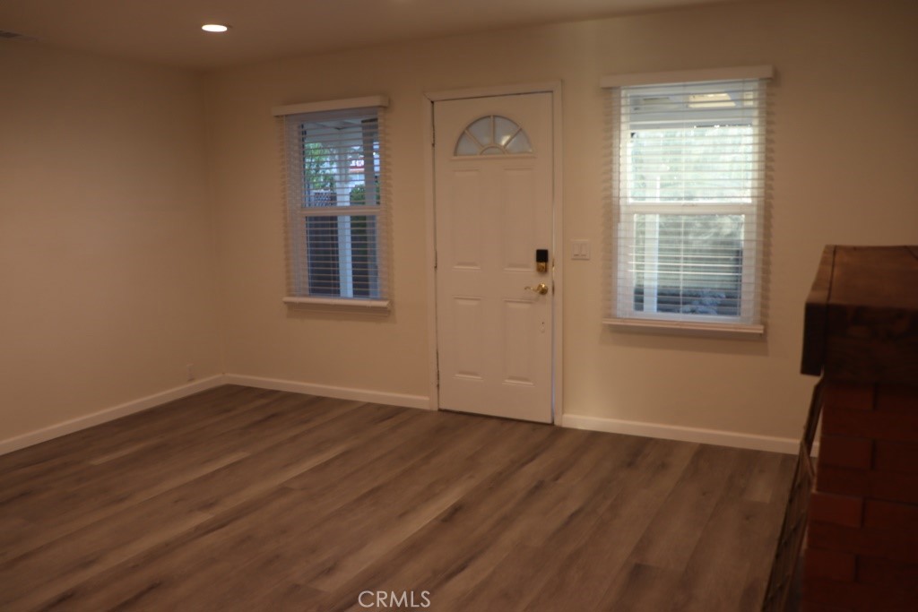6865 Morro Road, Unit A Atascadero, CA 93422 - Photo 33 of 41 an empty room with wooden floor and windows