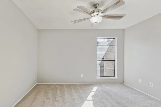 a bathroom with a shower sink and mirror