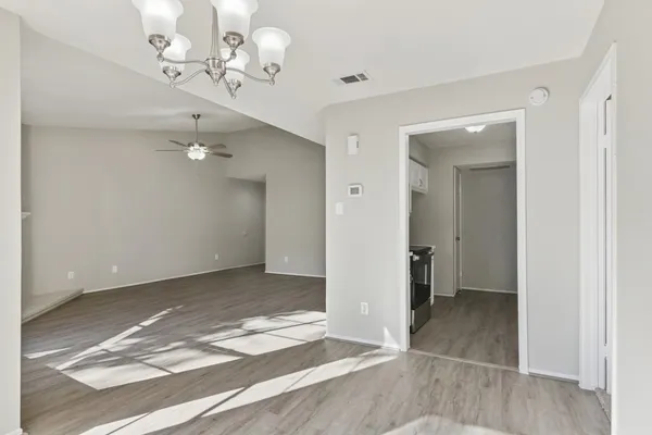 wooden floor in an empty room with a mirror