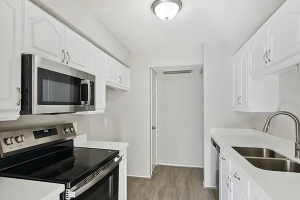 a kitchen with a stove and a microwave