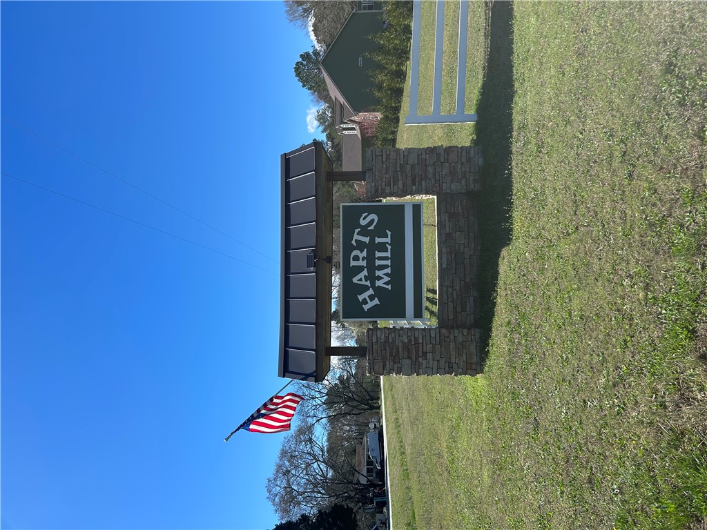 0 Harts Mill Road Hartwell, GA 30643 - Photo 1 of 3 Welcome to a distinguished community, marked by classic stone pillars and lush surroundings.