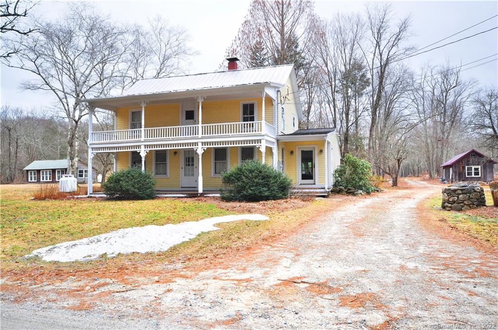 75 Valinsky Road Lebanon, CT 06249 - Photo 1 of 1 a front view of a house with a yard and trees