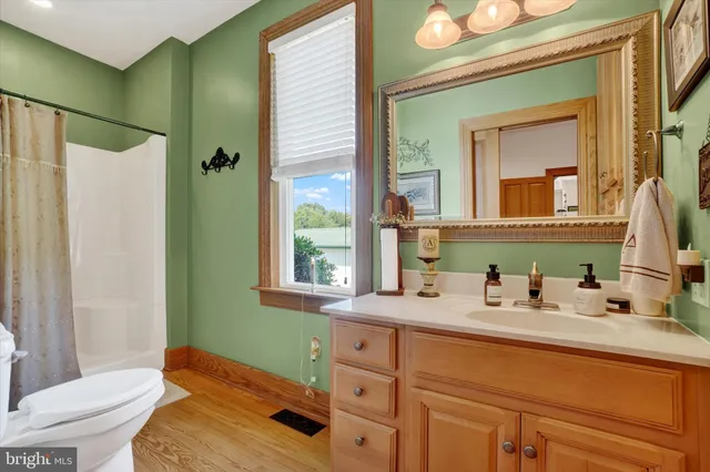 a view of walk in closet with clothes