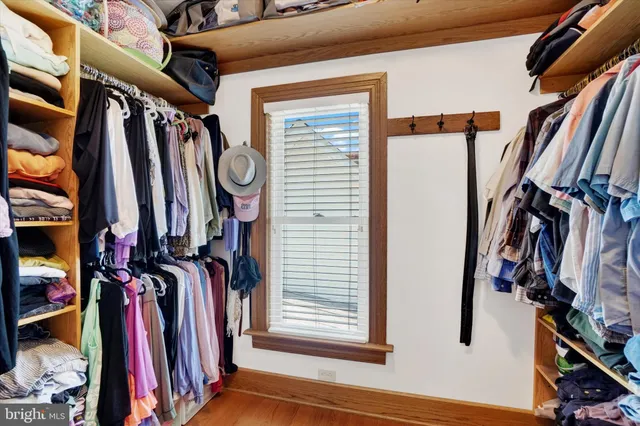 a bed room with furniture and a window