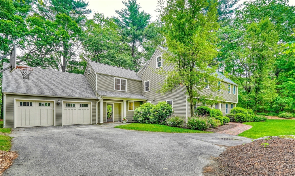 43 Old Pickard Road Concord, MA 01742 - Photo 2 of 27 a view of a brick building next to a yard with big trees