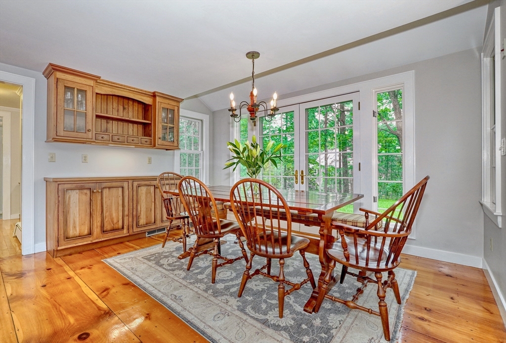 43 Old Pickard Road Concord, MA 01742 - Photo 7 of 27 a dining room with furniture a rug and wooden floor