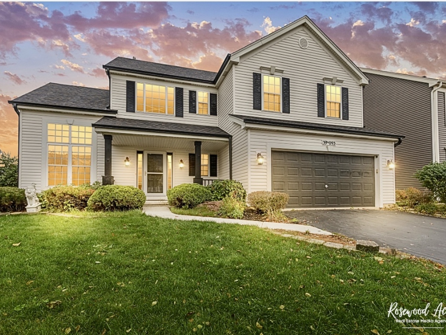 front view of a house with a yard