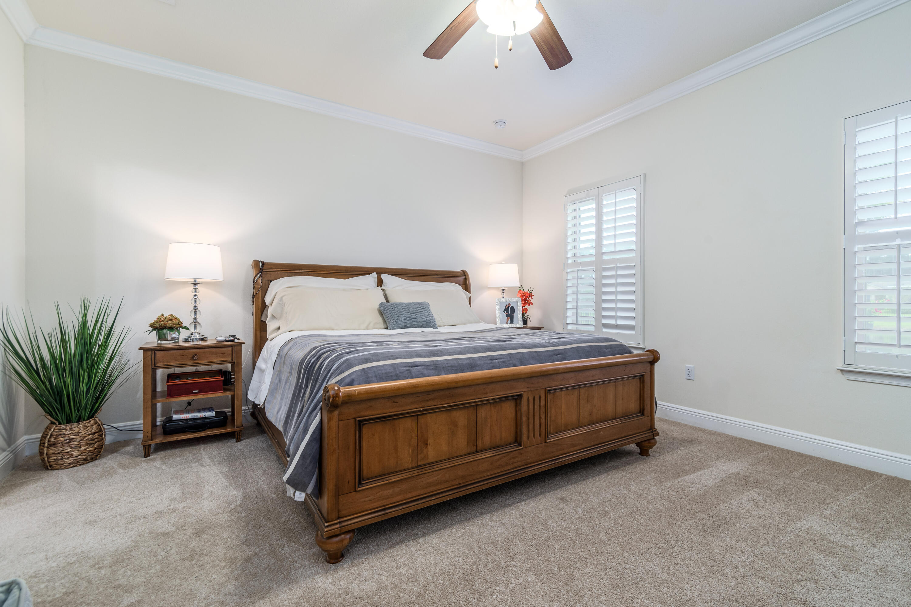 142 Pin Oak Loop Santa Rosa Beach, FL 32459 - Photo 17 of 56 a bed sitting in a bedroom next to a window and a chandelier