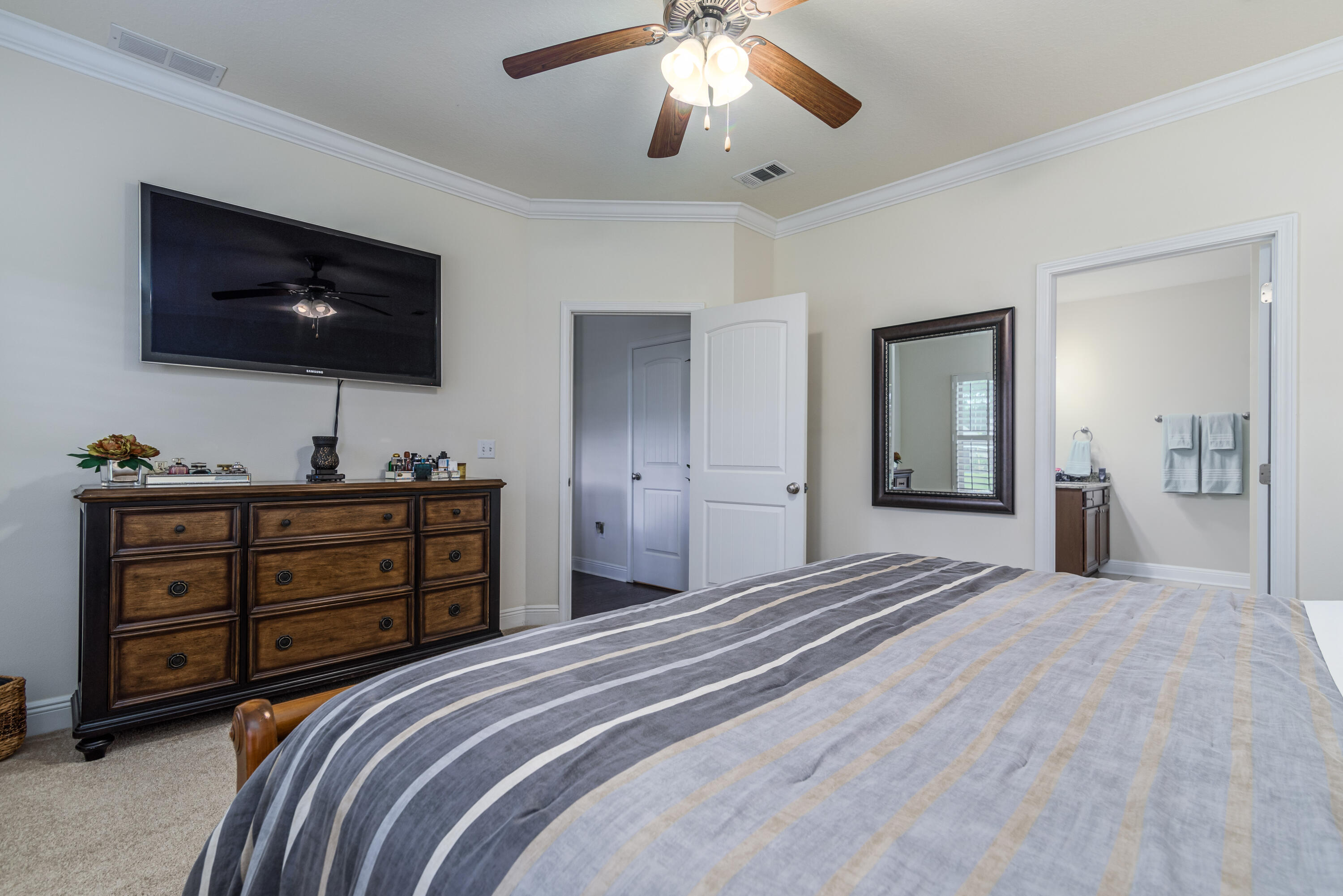 142 Pin Oak Loop Santa Rosa Beach, FL 32459 - Photo 19 of 56 a bedroom with a bed and a flat screen tv