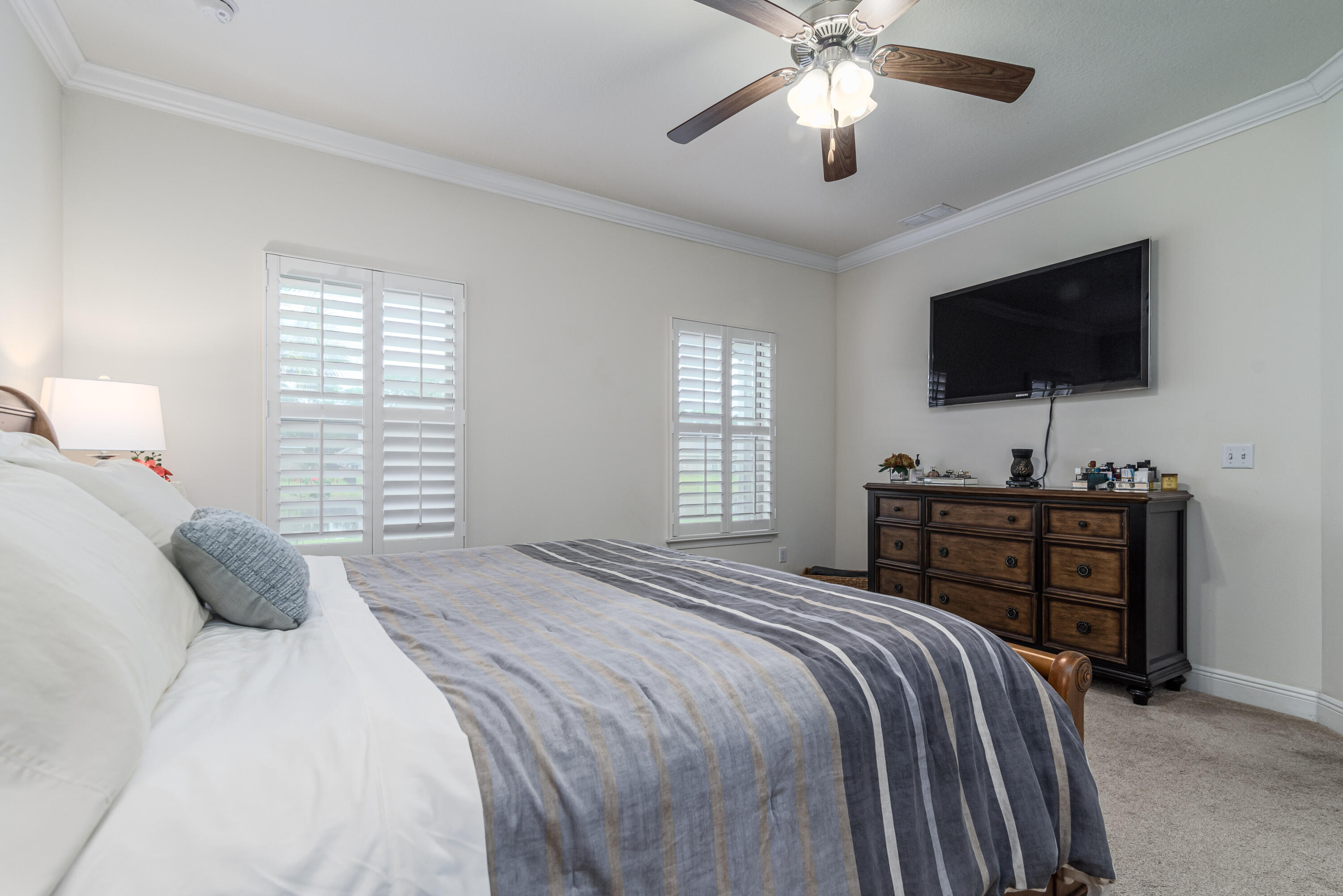 142 Pin Oak Loop Santa Rosa Beach, FL 32459 - Photo 20 of 56 a bedroom with a bed and a flat screen tv