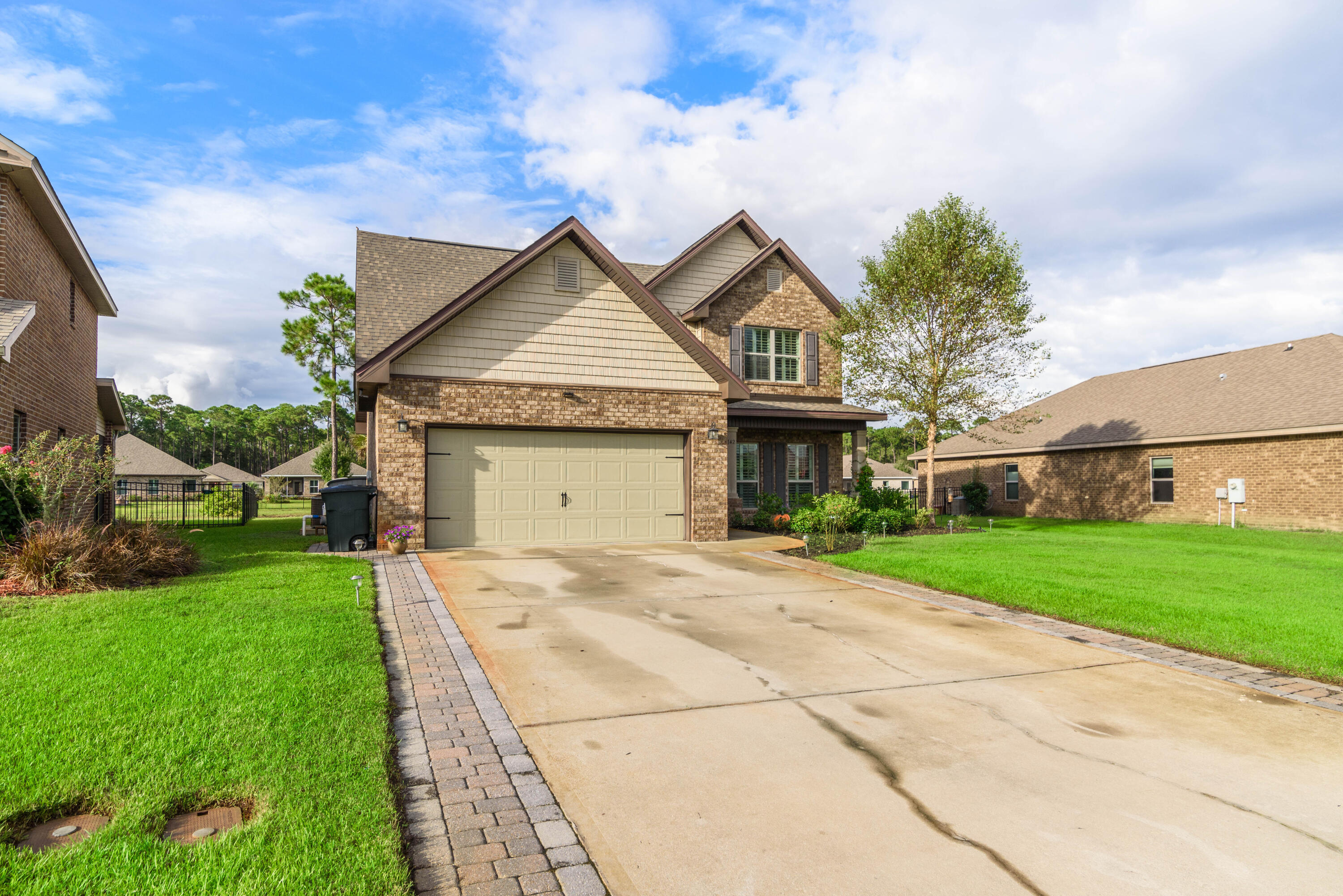 142 Pin Oak Loop Santa Rosa Beach, FL 32459 - Photo 2 of 56 a front view of a house with yard