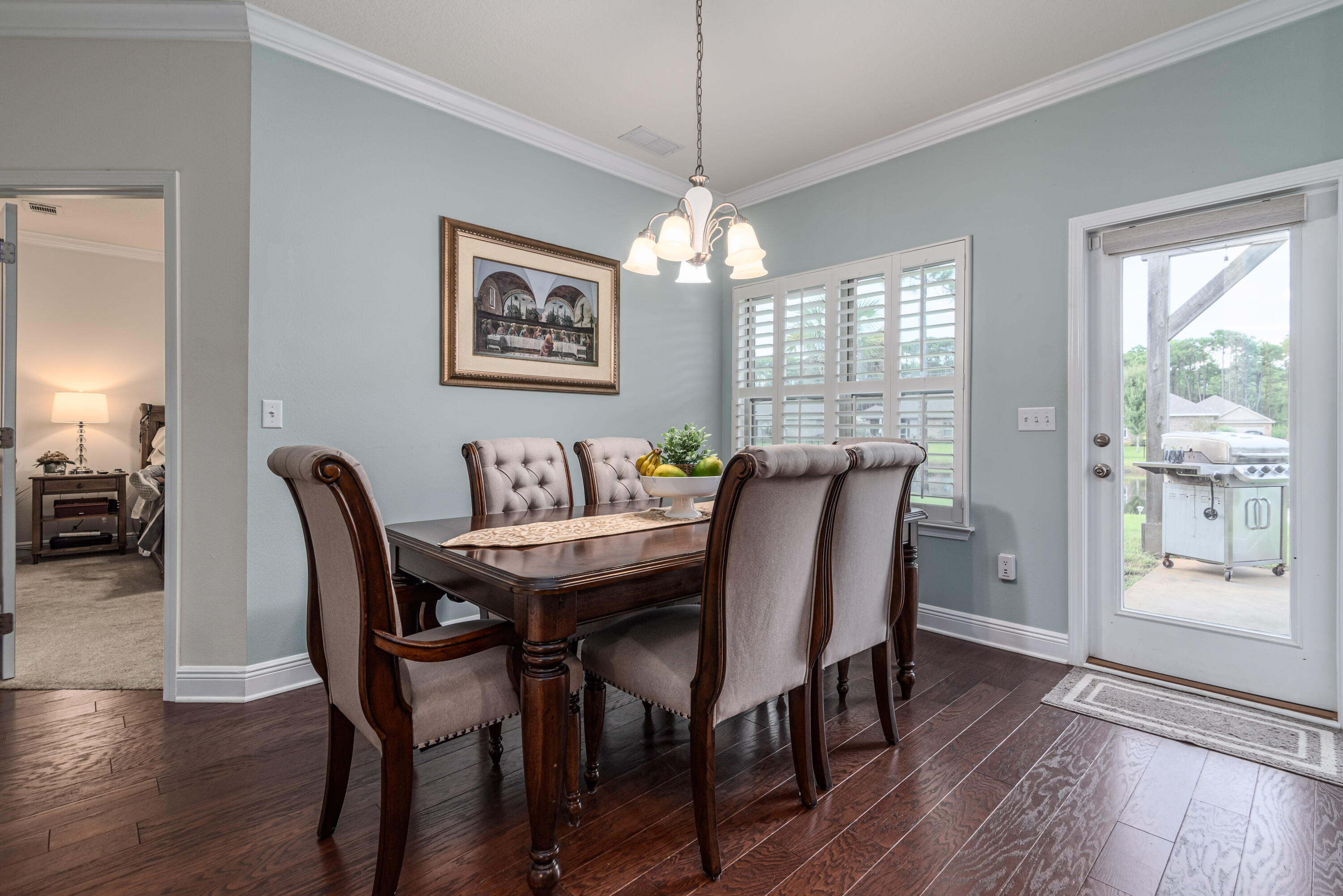 142 Pin Oak Loop Santa Rosa Beach, FL 32459 - Photo 26 of 56 a view of a dining room with furniture window and wooden floor