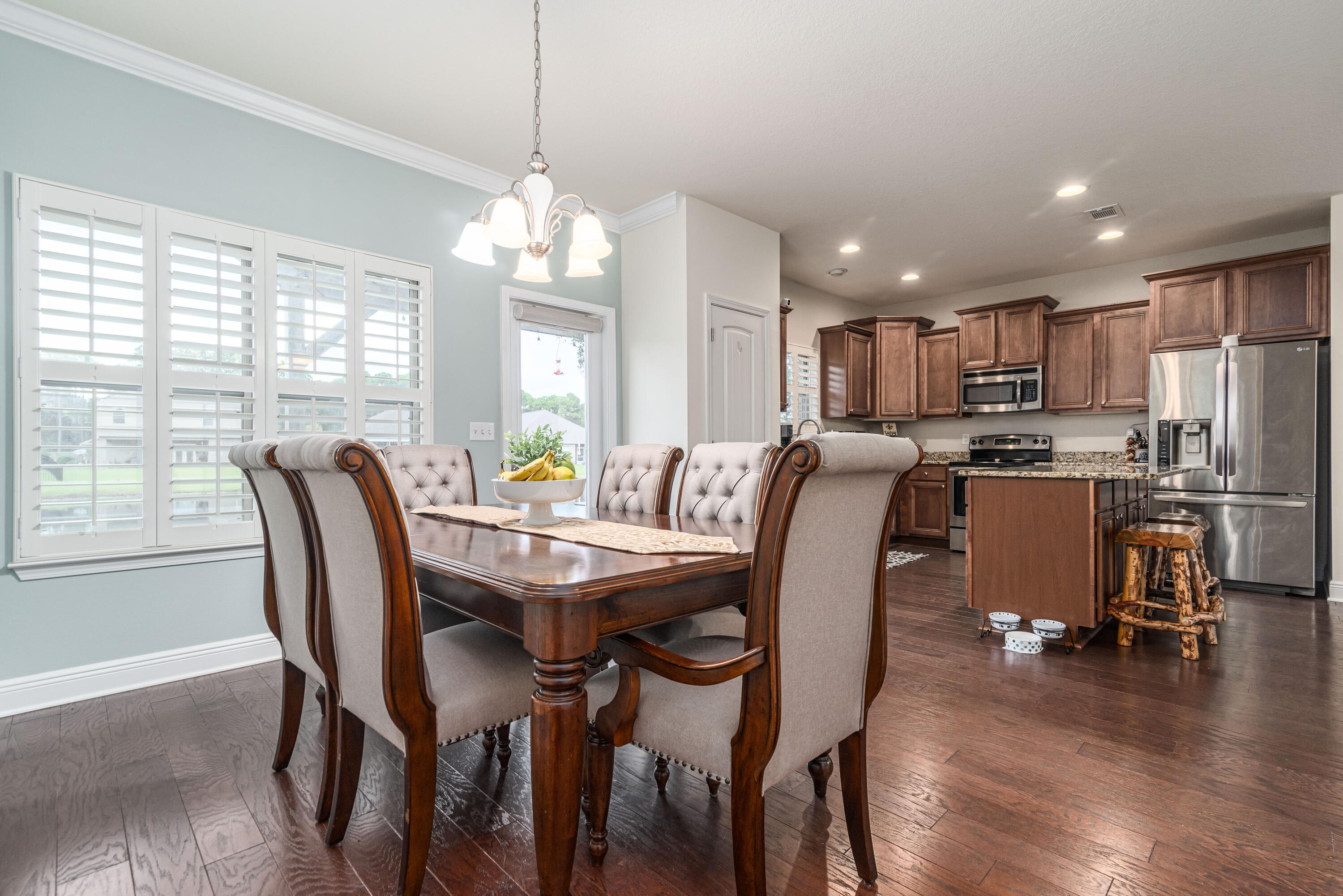142 Pin Oak Loop Santa Rosa Beach, FL 32459 - Photo 27 of 56 a view of a dining room with furniture window and wooden floor
