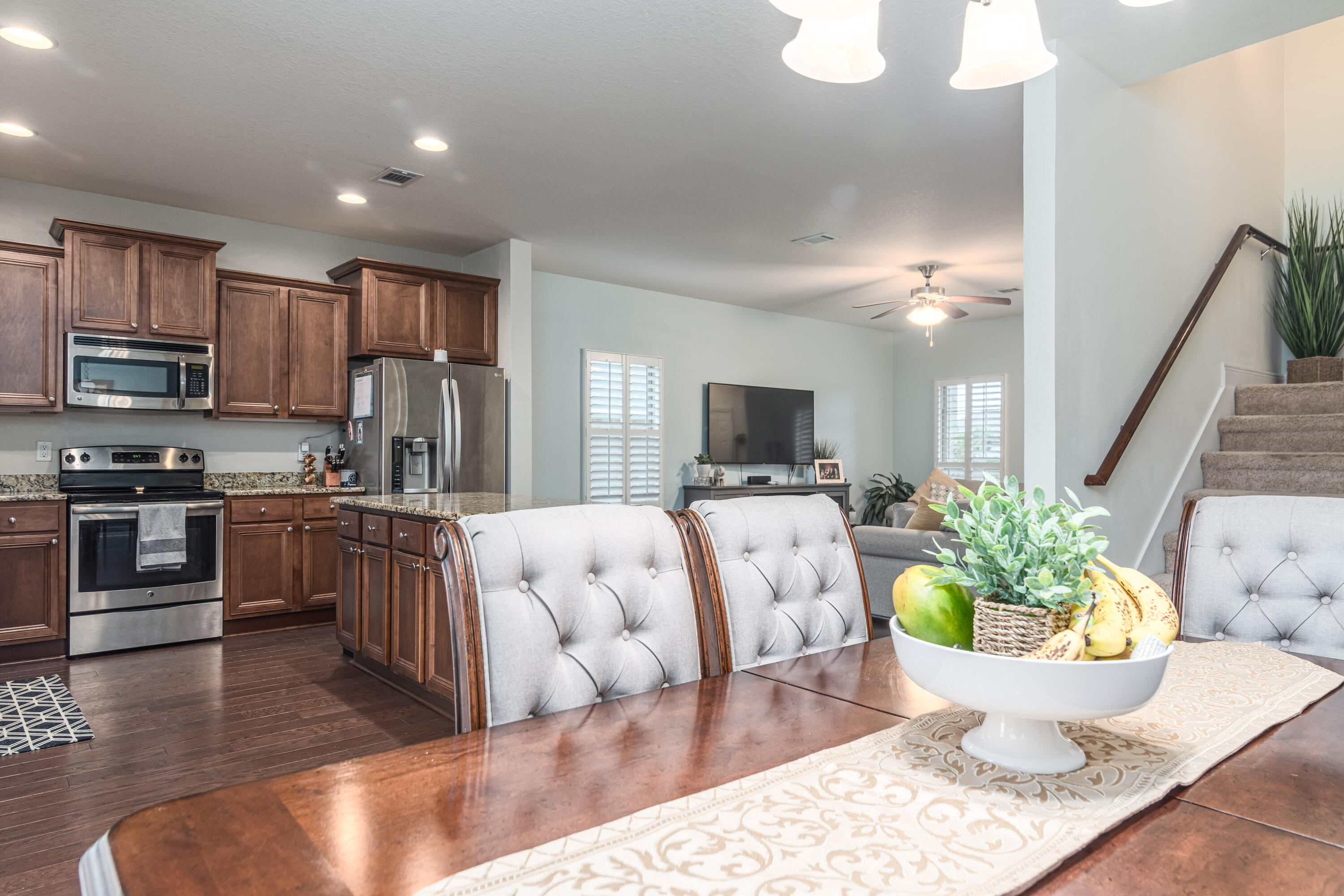 142 Pin Oak Loop Santa Rosa Beach, FL 32459 - Photo 28 of 56 a living room with furniture a kitchen view and a potted plant