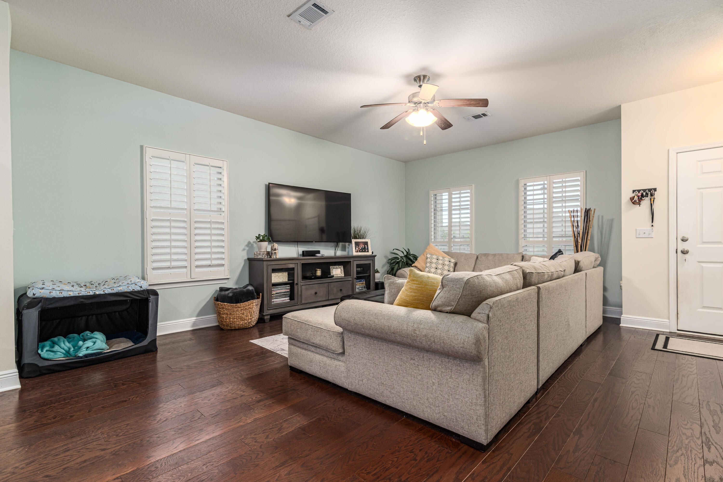 142 Pin Oak Loop Santa Rosa Beach, FL 32459 - Photo 36 of 56 a living room with furniture and a flat screen tv