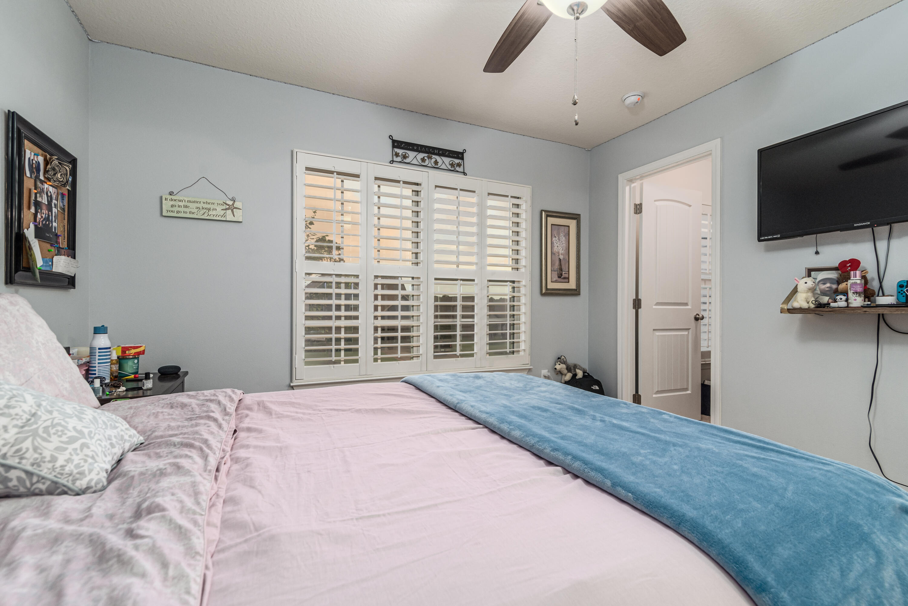 142 Pin Oak Loop Santa Rosa Beach, FL 32459 - Photo 50 of 56 a bedroom with a bed and a flat screen tv