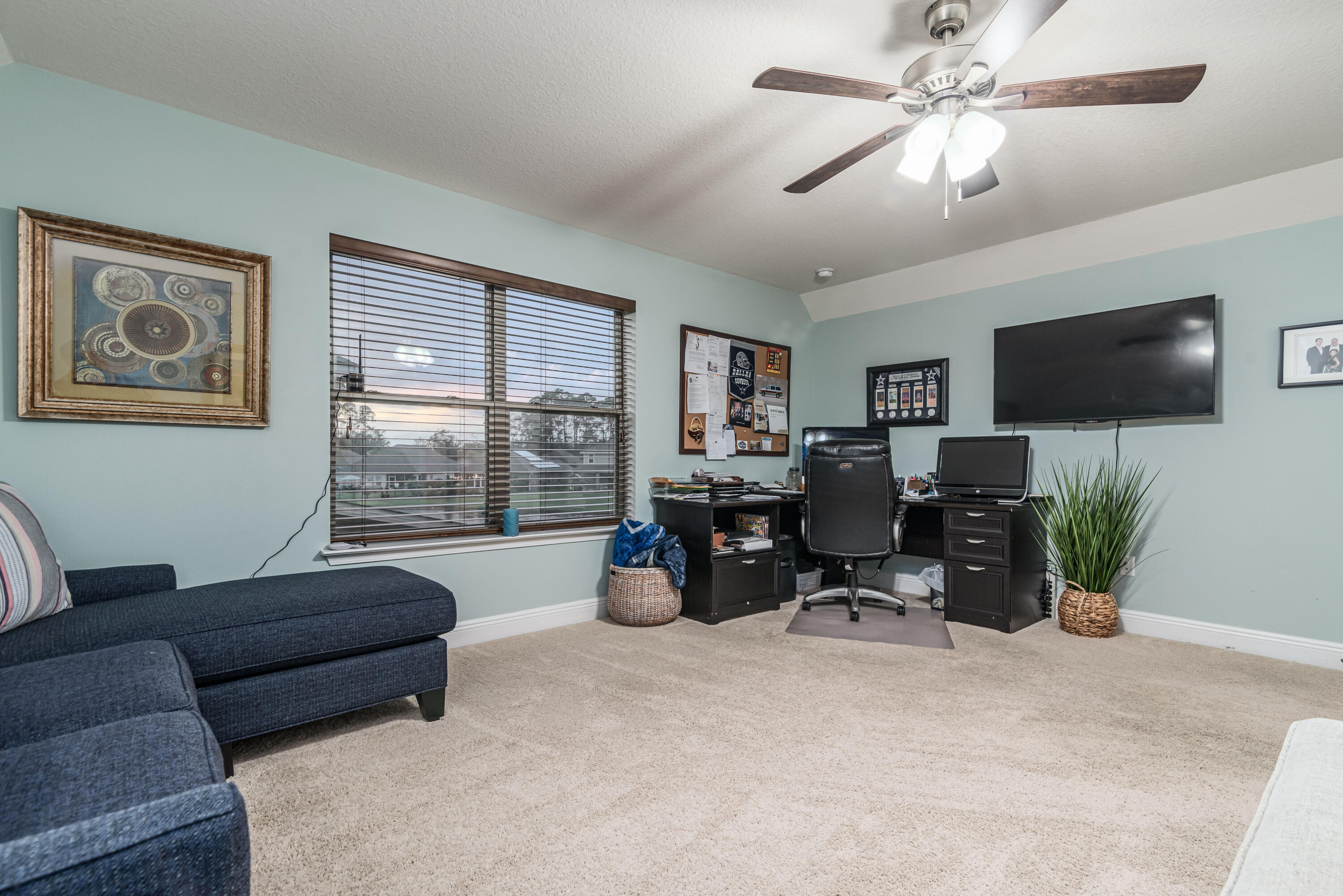 142 Pin Oak Loop Santa Rosa Beach, FL 32459 - Photo 55 of 56 a living room with furniture and a flat screen tv