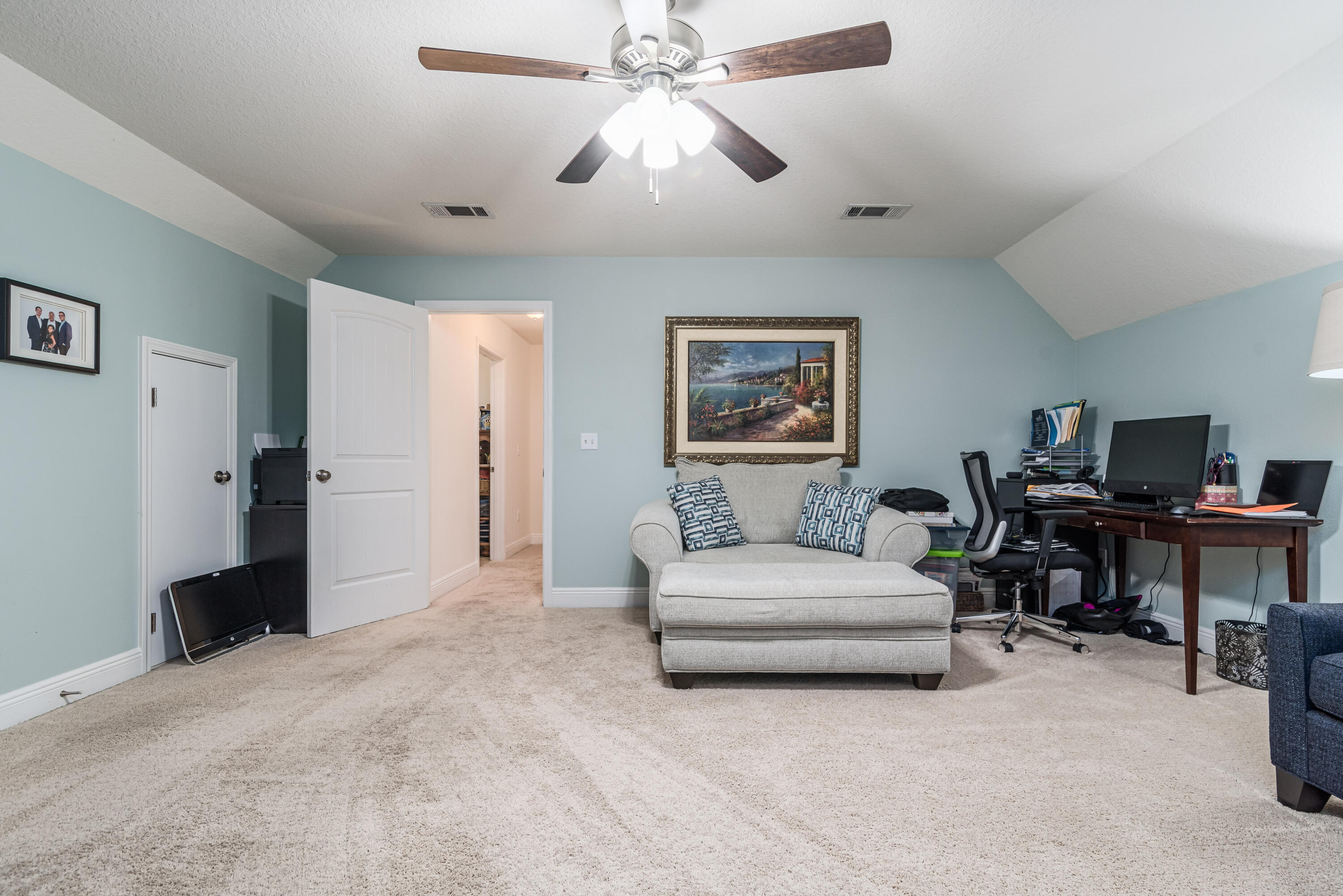 142 Pin Oak Loop Santa Rosa Beach, FL 32459 - Photo 56 of 56 a spacious bedroom with a bed and a chandelier