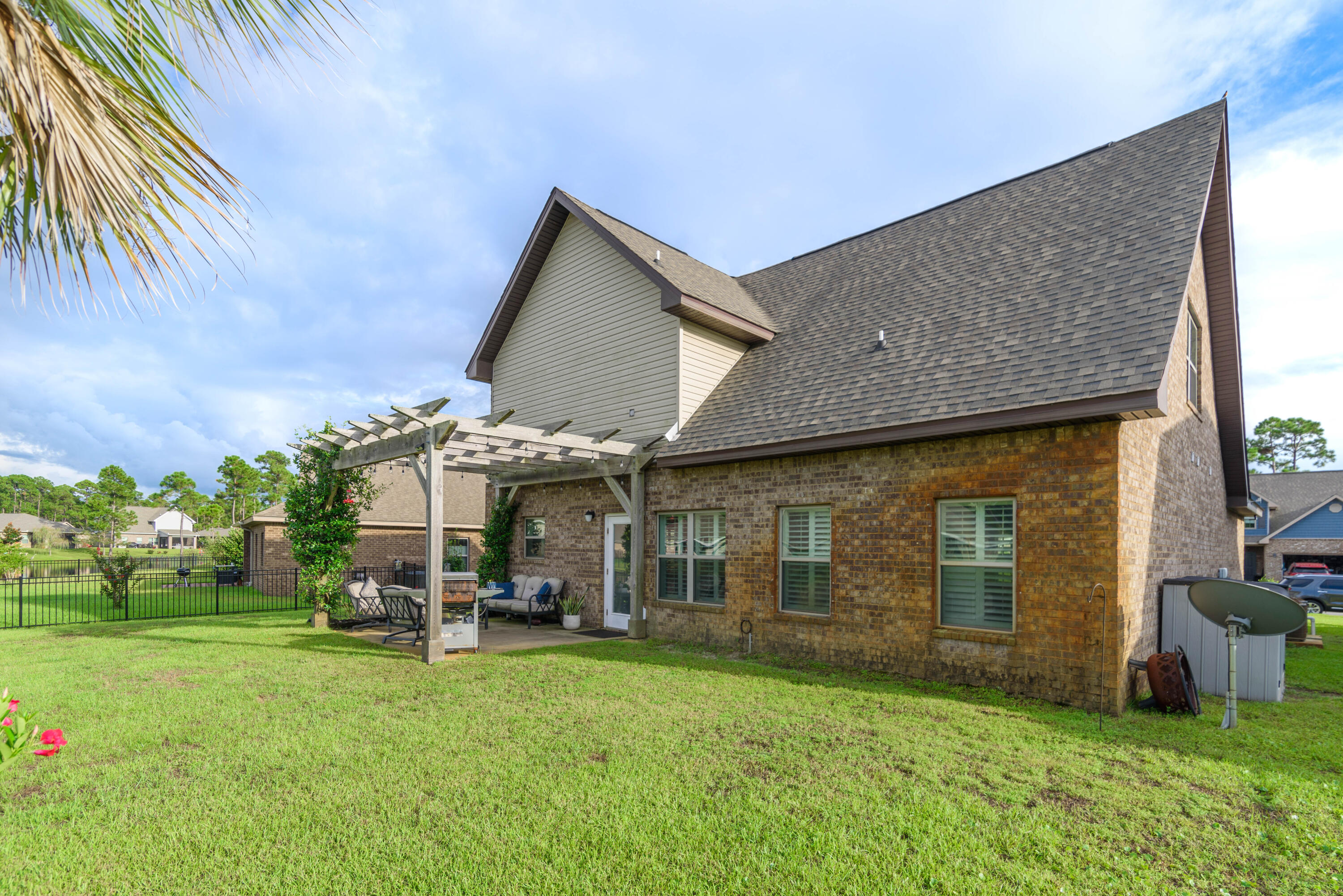 142 Pin Oak Loop Santa Rosa Beach, FL 32459 - Photo 10 of 56 a view of a house with backyard and porch