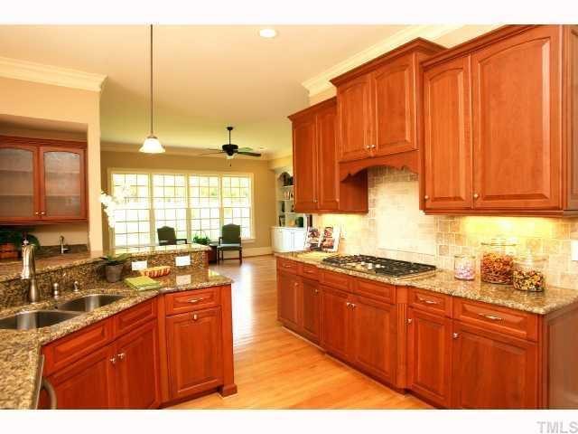 7919 Longleaf Branch Court Raleigh, NC 27612 - Photo 4 of 12 Wet bar with wine fridge on wall on left of picture.