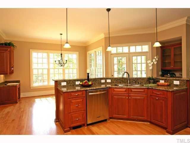 7919 Longleaf Branch Court Raleigh, NC 27612 - Photo 5 of 12 Granite countertops and stainless steel appliances.