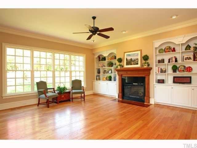7919 Longleaf Branch Court Raleigh, NC 27612 - Photo 7 of 12 Family room with fireplace and built-ins