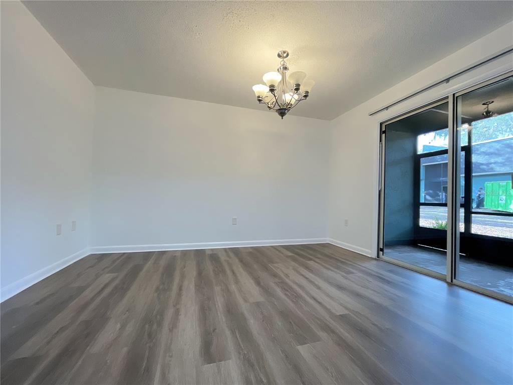 501 Southwest 75th Street, Unit C4 Gainesville, FL 32607 - Photo 24 of 37 wooden floor in an empty room with a window