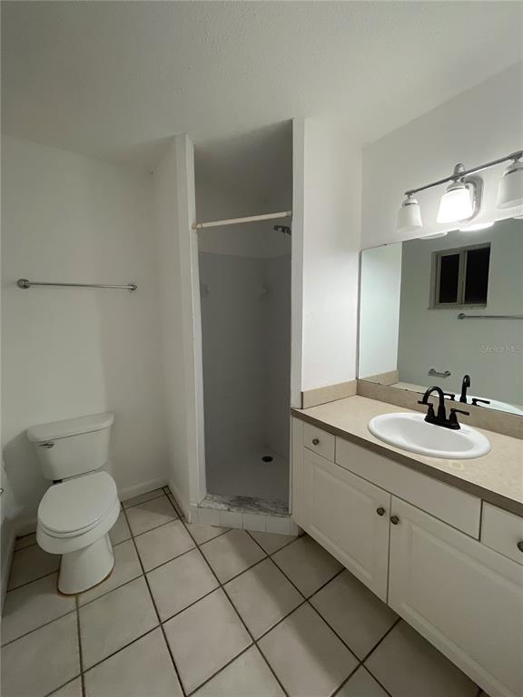 501 Southwest 75th Street, Unit C4 Gainesville, FL 32607 - Photo 26 of 37 a bathroom with a toilet sink and mirror