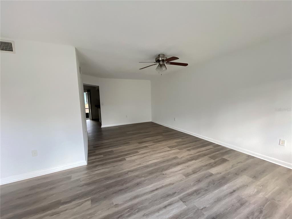 501 Southwest 75th Street, Unit C4 Gainesville, FL 32607 - Photo 27 of 37 wooden floor in an empty room