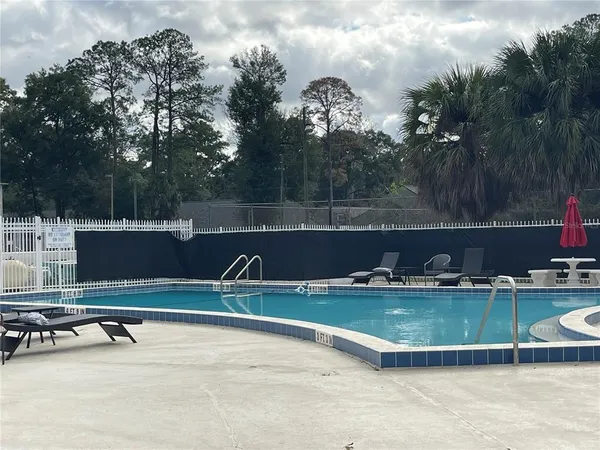 a view of a water with a table and chairs