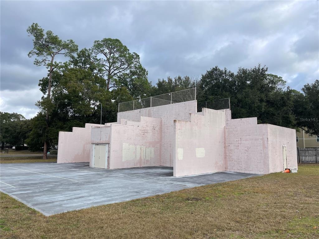 501 Southwest 75th Street, Unit C4 Gainesville, FL 32607 - Photo 37 of 37 a view of a white house with a yard and covered in snow