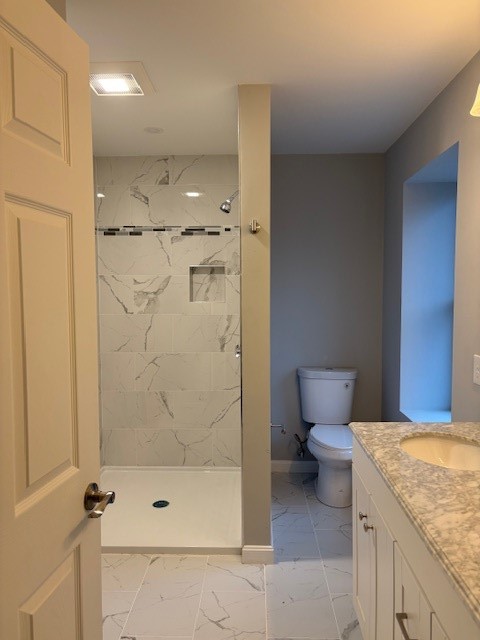 182 Avenue C, Unit S6 Woonsocket, RI 02895 - Photo 8 of 13 Primary bathroom featuring a double-sink vanity and a walk-in shower.