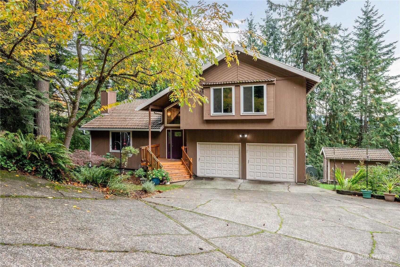 4415 Poplar Way Longview, WA 98632 - Photo 1 of 35 a front view of a house with garden