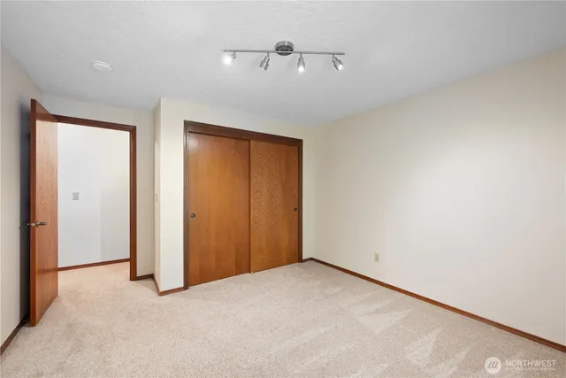 an empty room with a fan