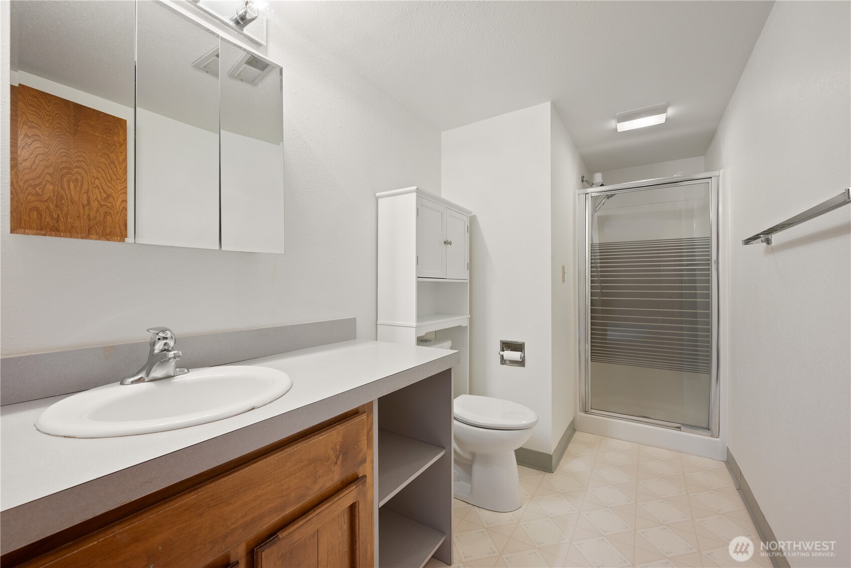 4415 Poplar Way Longview, WA 98632 - Photo 19 of 35 a bathroom with a sink toilet and shower
