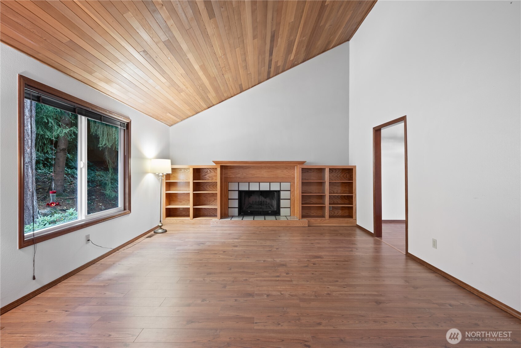 4415 Poplar Way Longview, WA 98632 - Photo 2 of 35 a view of an empty room with a window and fireplace