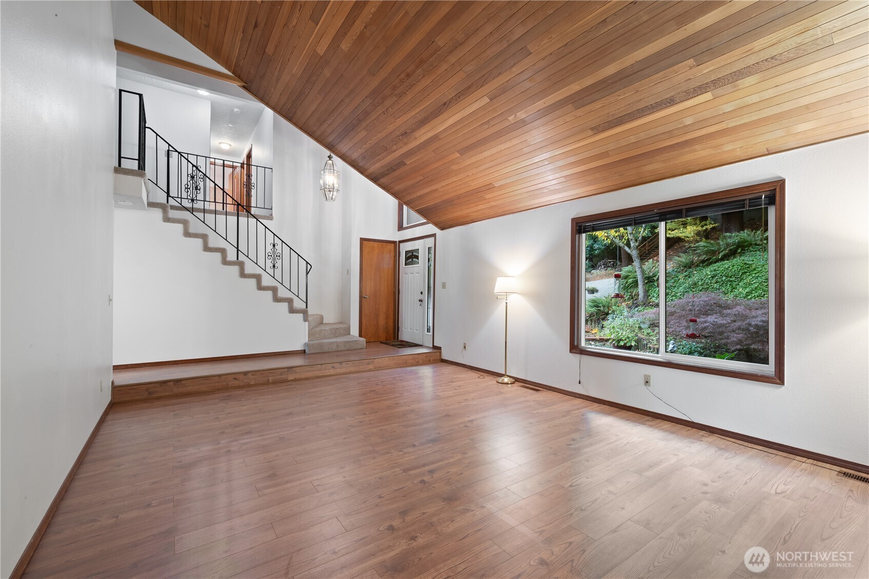 4415 Poplar Way Longview, WA 98632 - Photo 3 of 35 a view of an empty room with wooden floor and windows