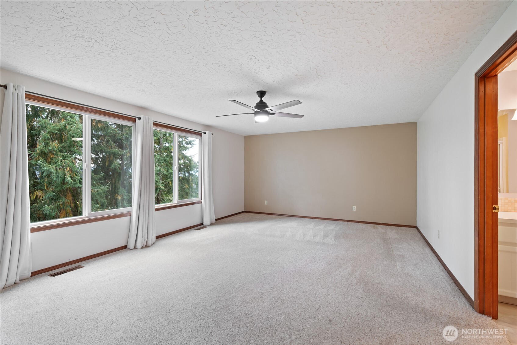 4415 Poplar Way Longview, WA 98632 - Photo 10 of 35 an empty room with windows and view