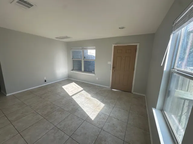 an empty room with windows