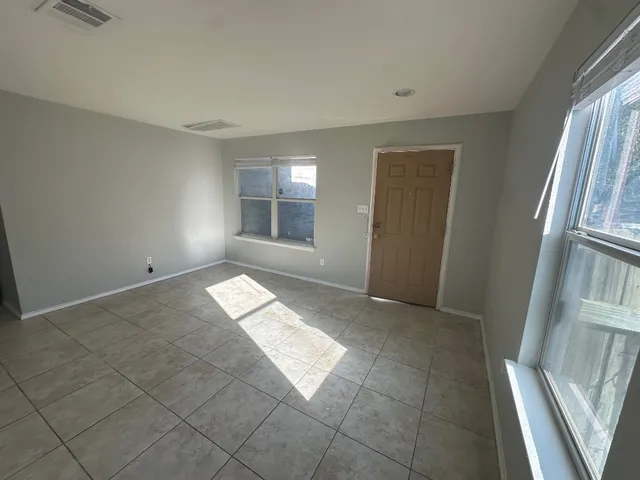 an empty room with windows