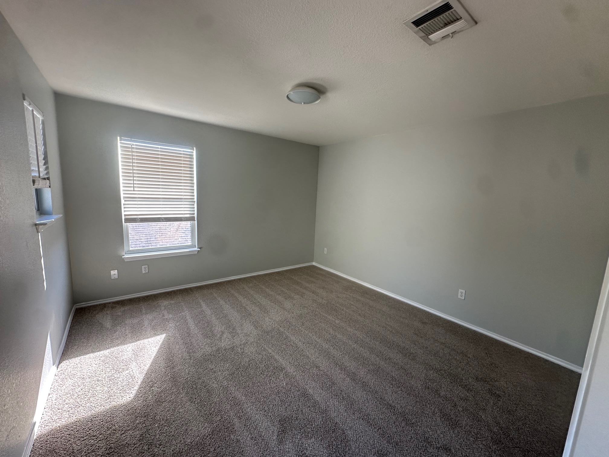102 Blanco Woods Boulevard Elgin, TX 78621 - Photo 8 of 12 an empty room with a window