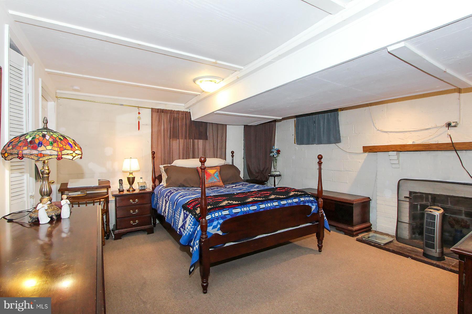 1111 Notley Road Silver Spring, MD 20904 - Photo 27 of 30 a bedroom with a bed and a chandelier