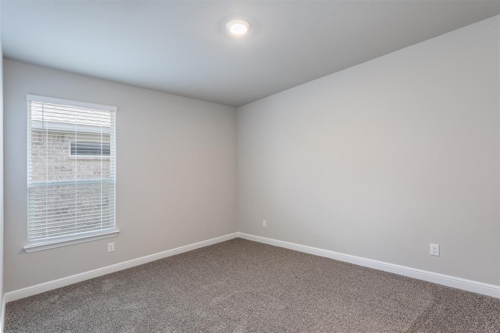 14621 Bootes Drive Haslet, TX 76052 - Photo 12 of 40 Empty room featuring carpet and baseboards