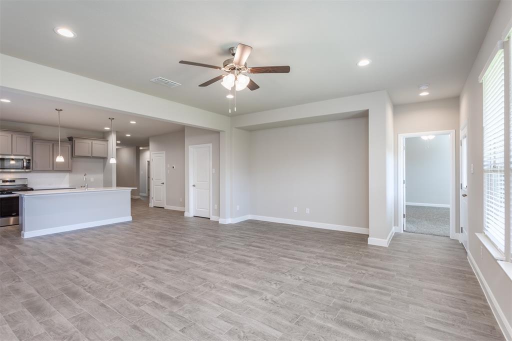 14621 Bootes Drive Haslet, TX 76052 - Photo 26 of 40 Unfurnished living room featuring ceiling fan, light wood-type flooring, and recessed lighting