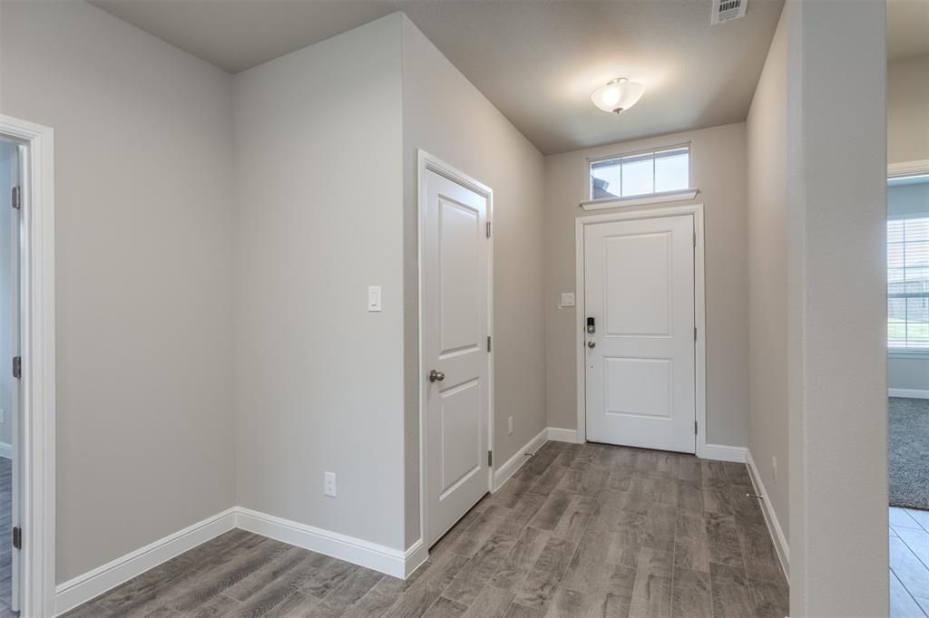 14621 Bootes Drive Haslet, TX 76052 - Photo 3 of 40 Entrance foyer with baseboards and light wood-type flooring