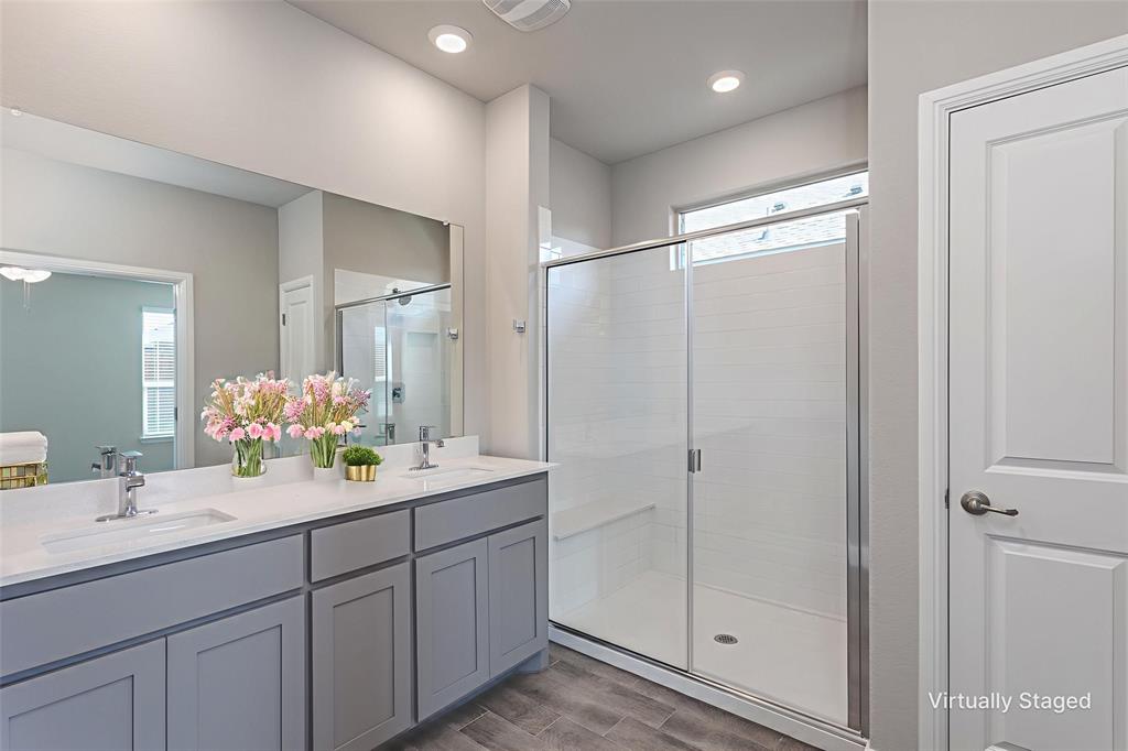 14621 Bootes Drive Haslet, TX 76052 - Photo 30 of 40 Bathroom featuring a shower stall, double vanity, wood finish floors, plenty of natural light, and recessed lighting