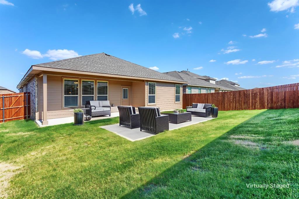 14621 Bootes Drive Haslet, TX 76052 - Photo 35 of 40 Back of house with outdoor lounge area, a patio area, a fenced backyard, and roof with shingles